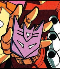 a panel of the decepticon symbol being held by rodimus